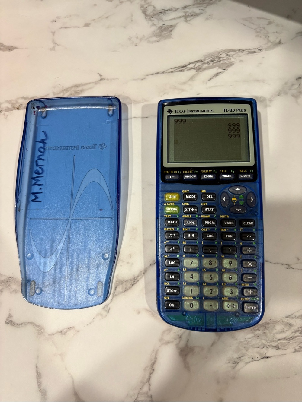 Texas Instruments TI-83 Plus Graphing Calculator in translucent blue